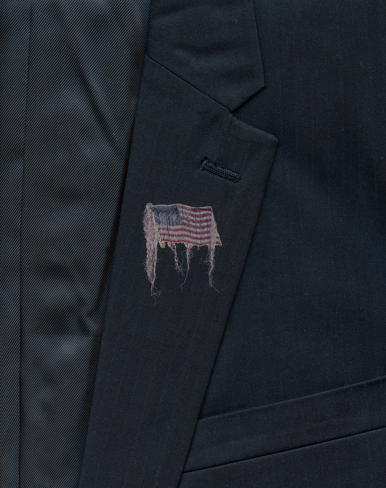 Unraveling: Suit with Lapel Pin - Detail, Lapel