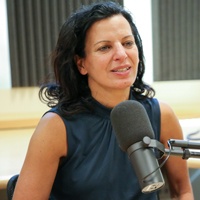 Juliette Kayyem speaking into a microphone 