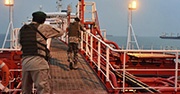 Soldiers of Iran's Revolutionary Guard inspect seized tanker in the Strait of Hormuz