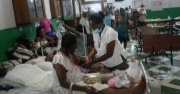 A Haitian woman receives treatment in a hospital after a devastating earthquake