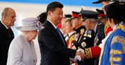 China's leader shakes hands with a British officer 