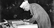 Jawaharlal Nehru signing Indian Constitution
