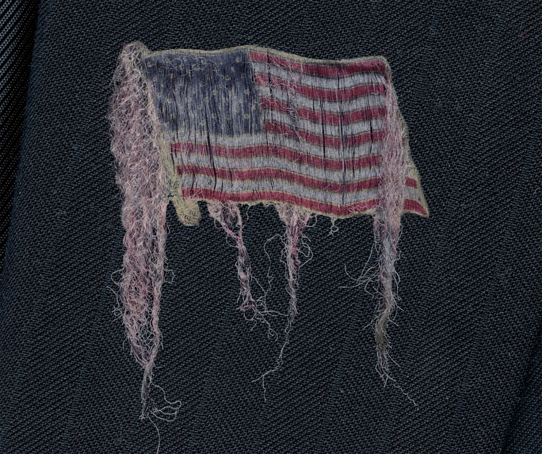 Unraveling: Suit with Lapel Pin - Detail, Flag